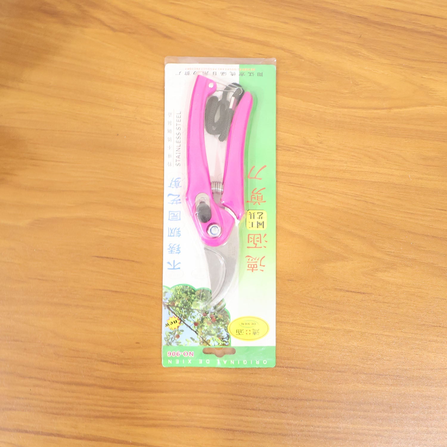 Stainless steel garden scissors cutting live plants