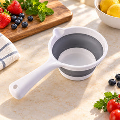 Close-up of collapsible water scoop.
