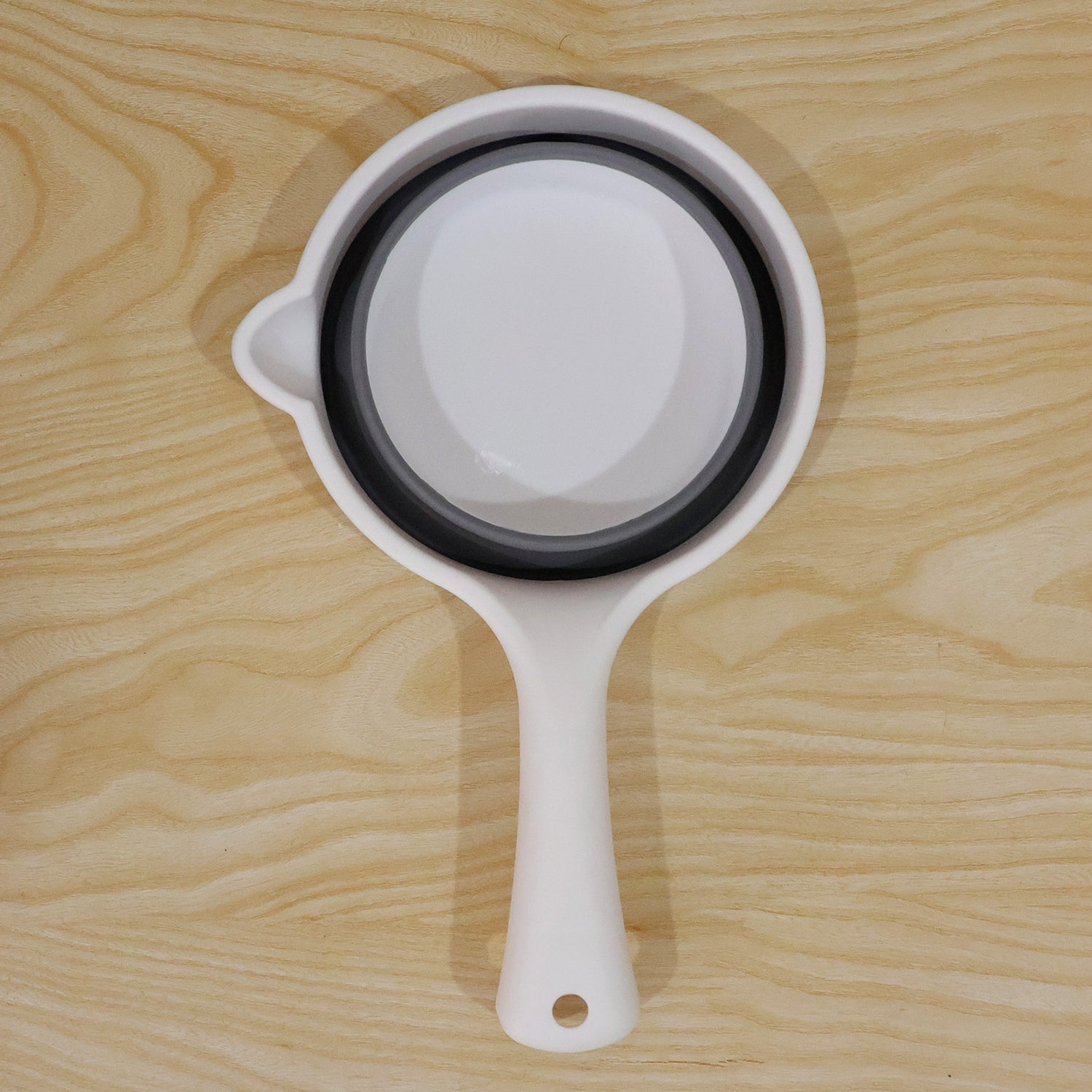 Display of collapsible water scoop.