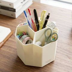 Close-up of 360 degree rotating base of desk organizer in cream color