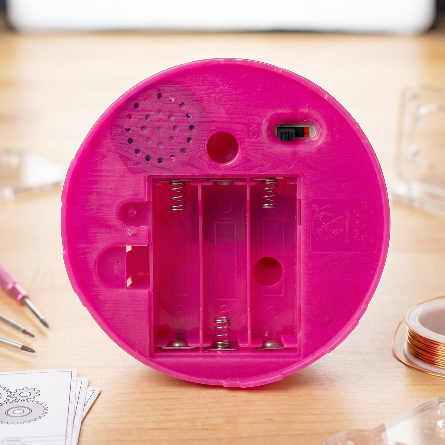 Colorful and fun kids toy with sound effects and interactive features in a cage.