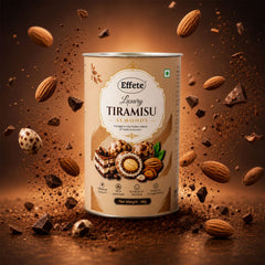 A brown canister of Effete Luxury Tiramisu Almonds with almonds, chocolate pieces, and cocoa powder floating around it.