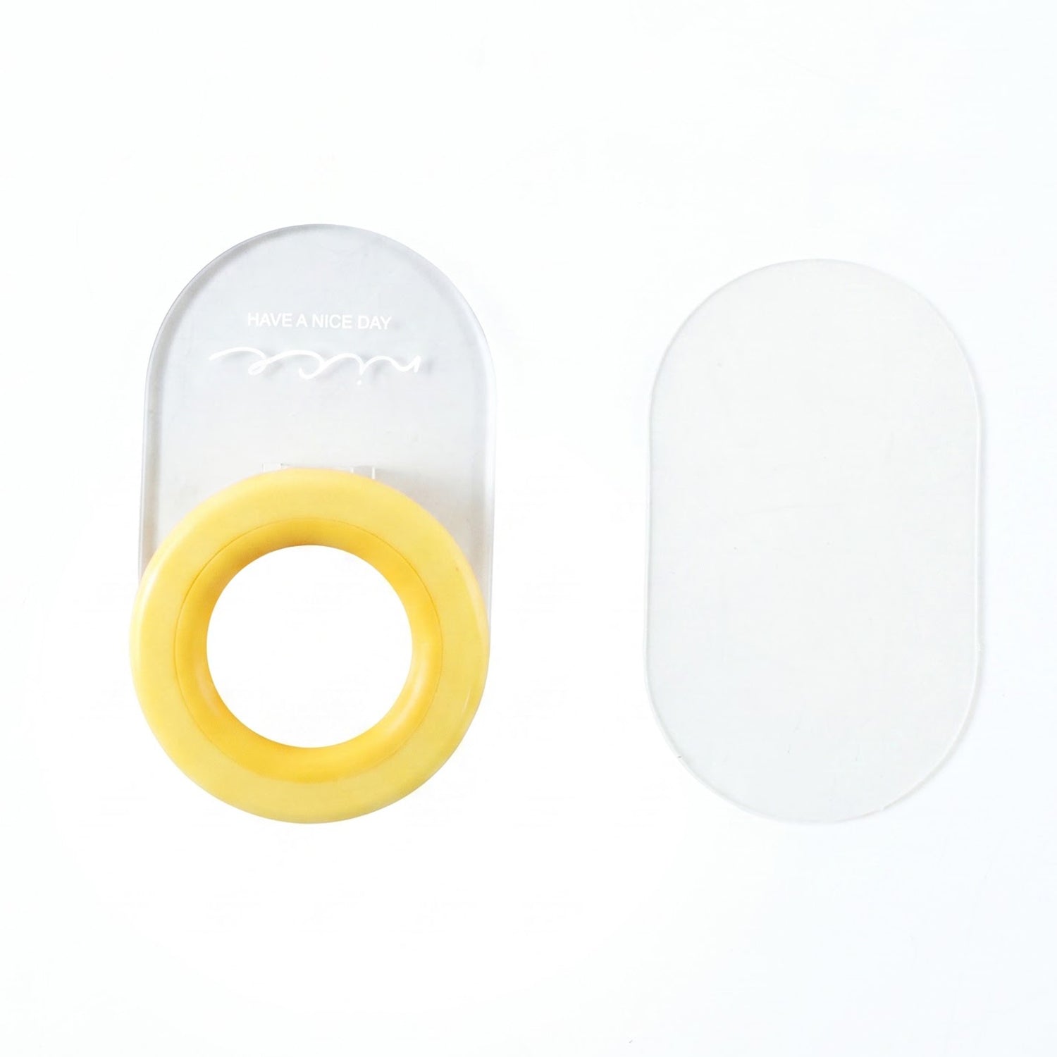 Plastic toilet seat lifter on white background
