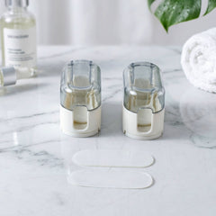 Toothbrush holder mounted on a bathroom wall