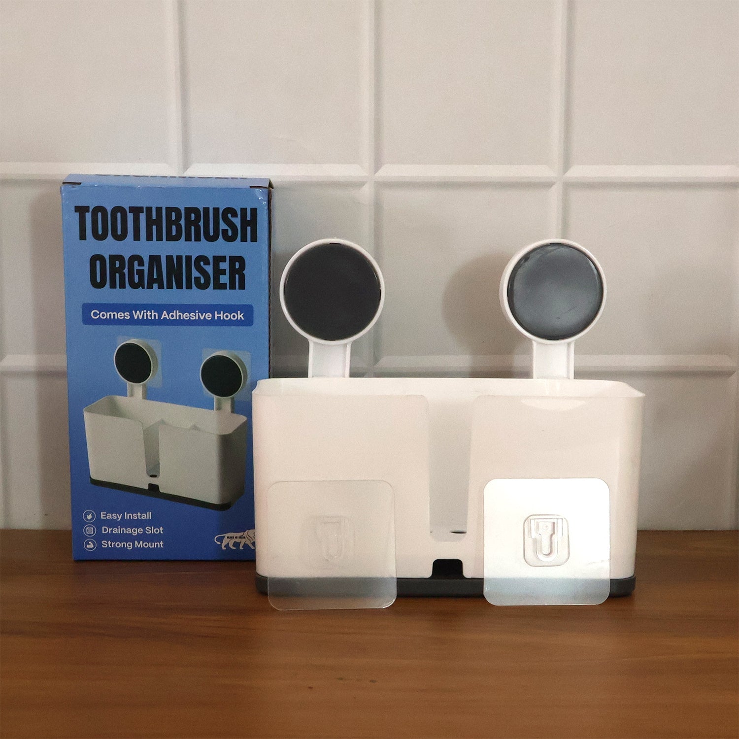 Adhesive back of wall mounted toothbrush holder