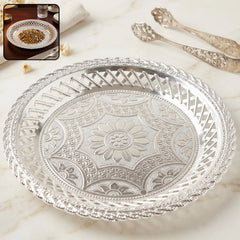 Elegant silver round serving tray with embossed floral design and lattice border