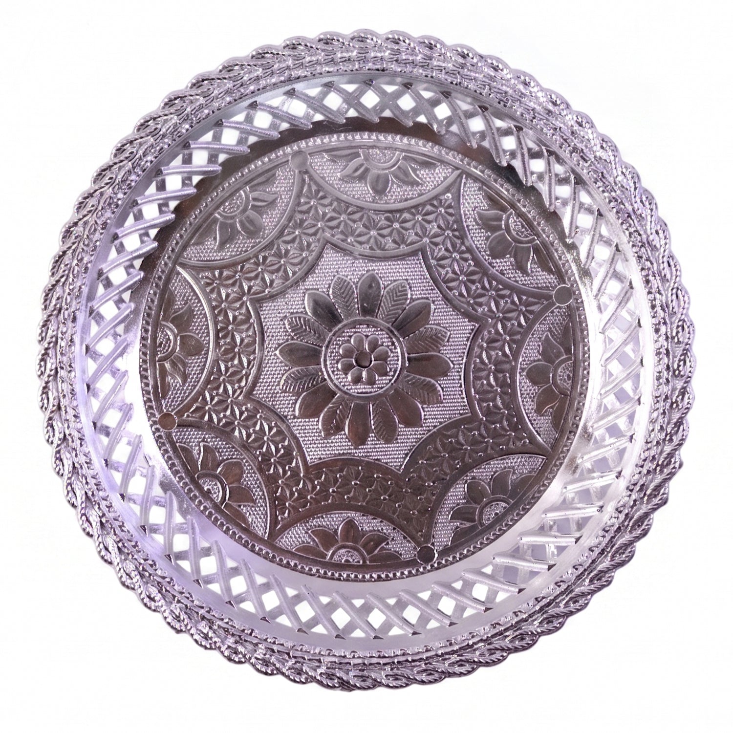 Round silver serving tray with intricate embossing and lattice border