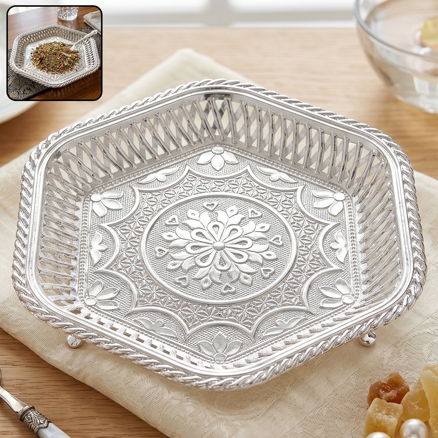Decorative silver square serving tray with embossed floral design and lattice border