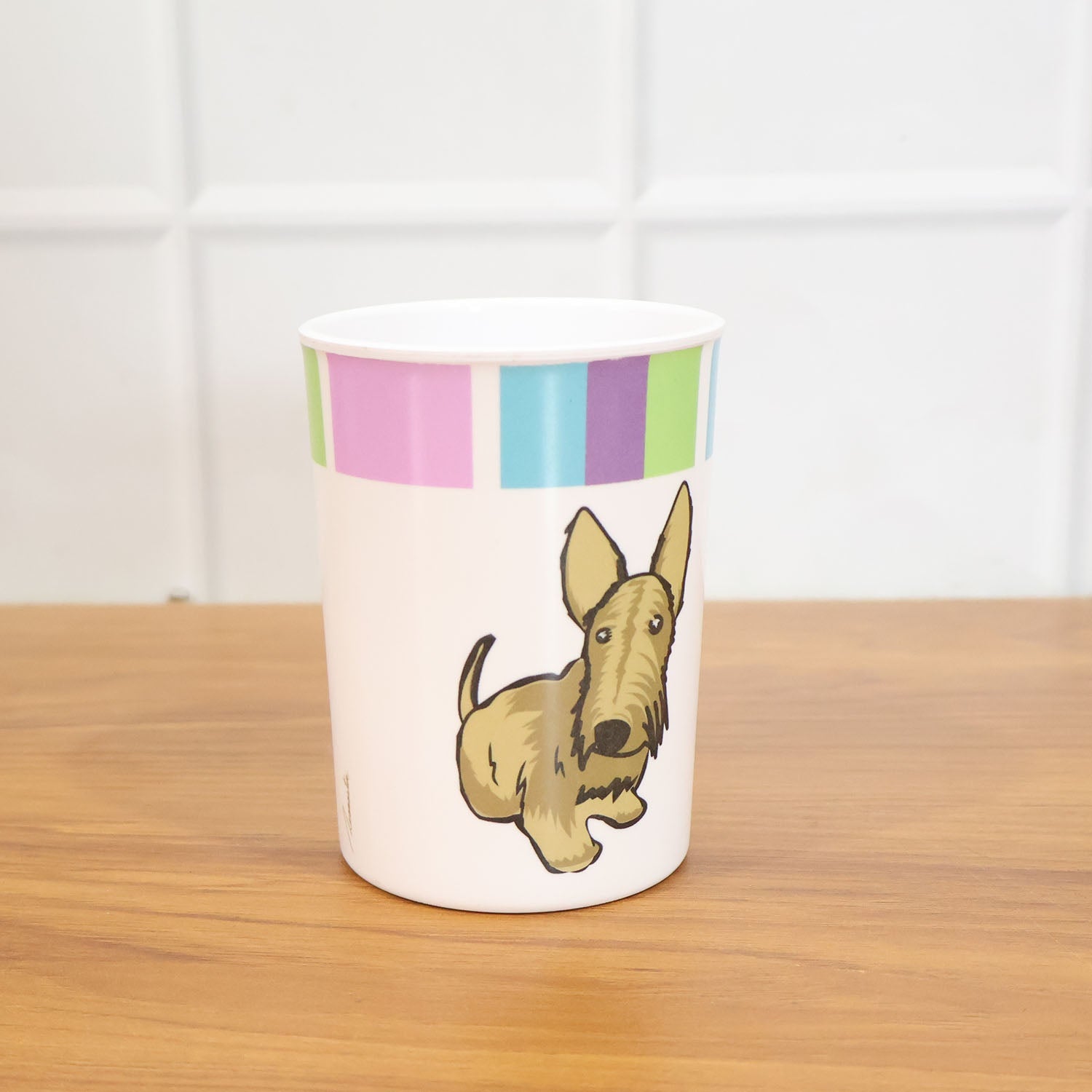 Kids using cartoon melamine drinking glass at table