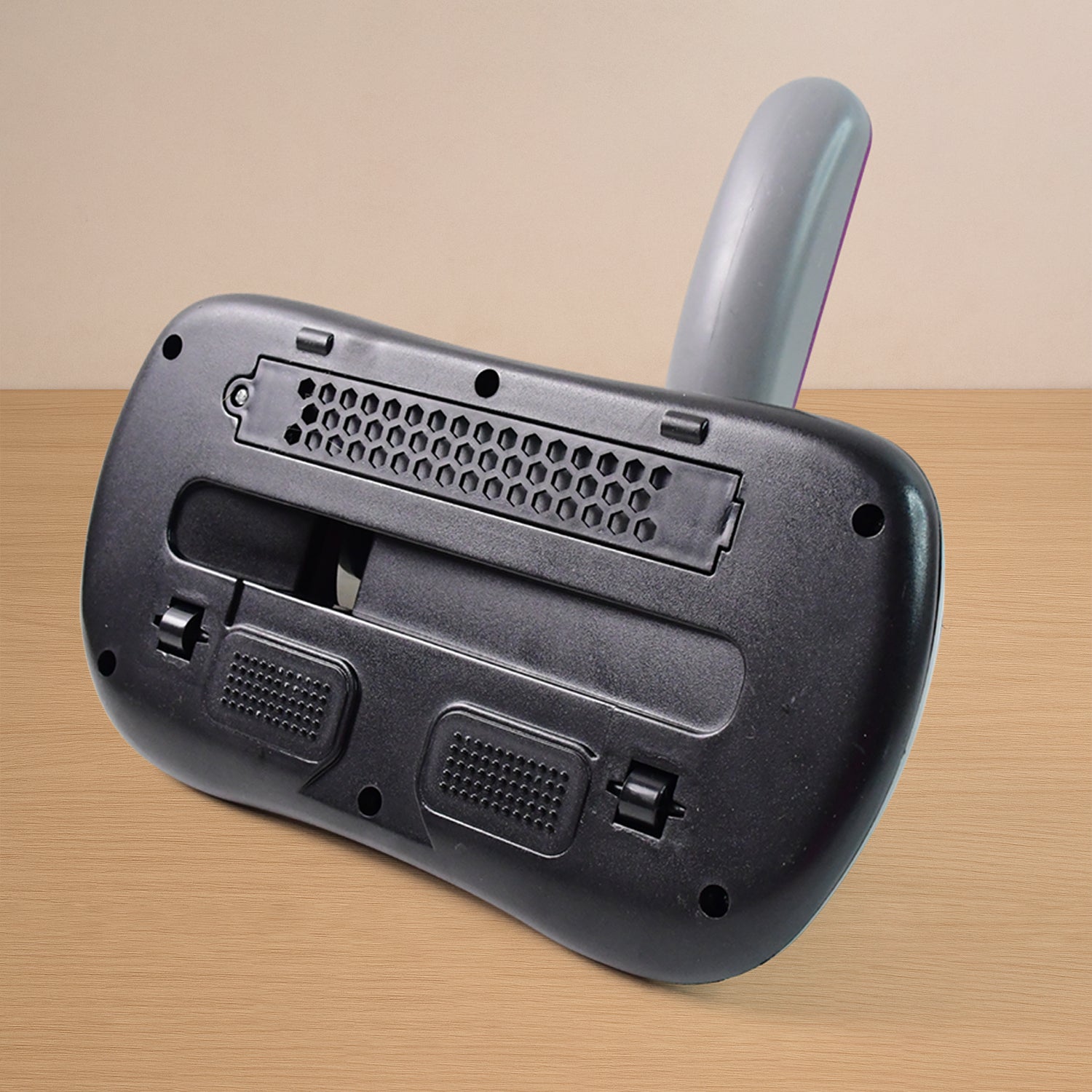 Handheld vacuum cleaner operating on sofa fabric