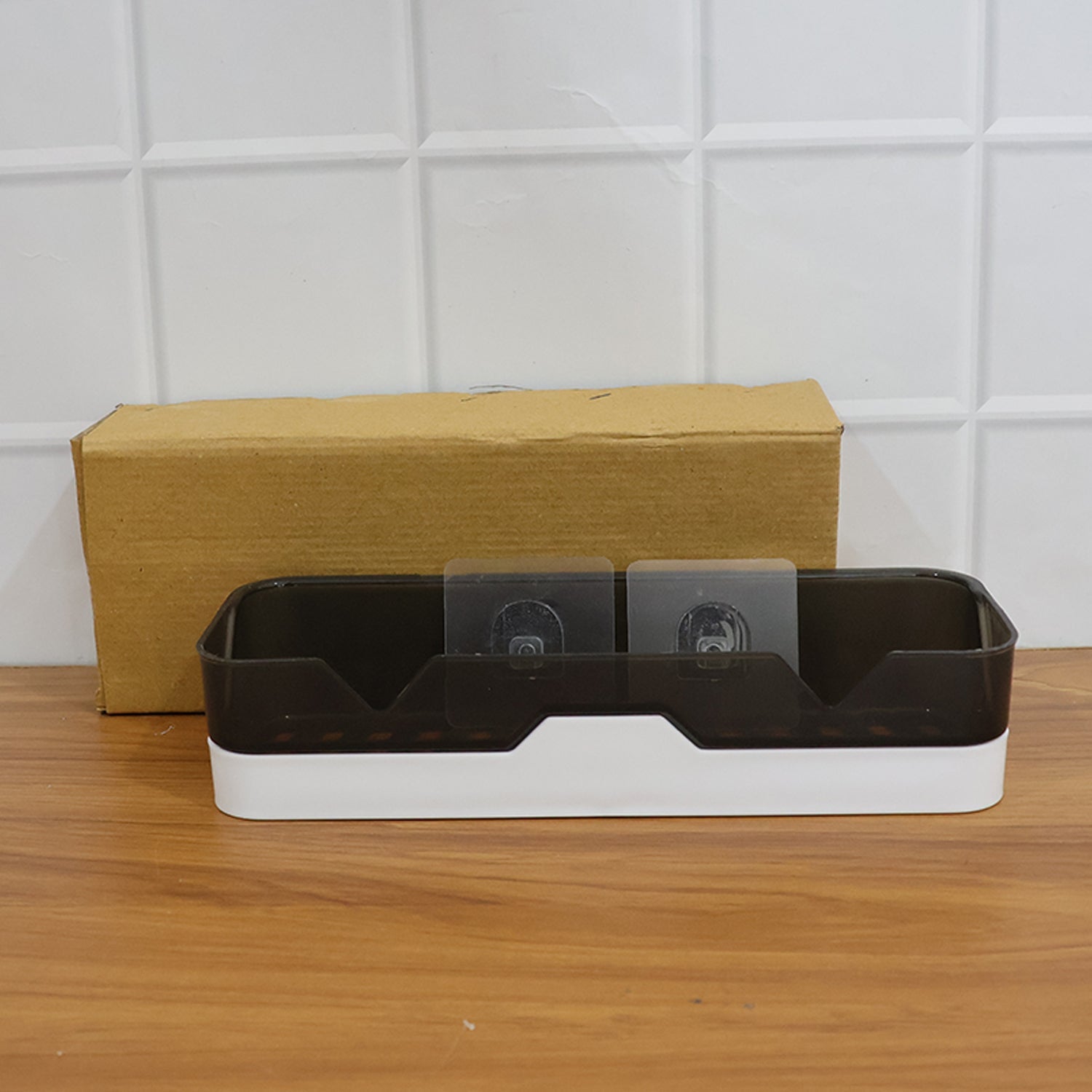 Wall mounted adhesive shelf displaying items