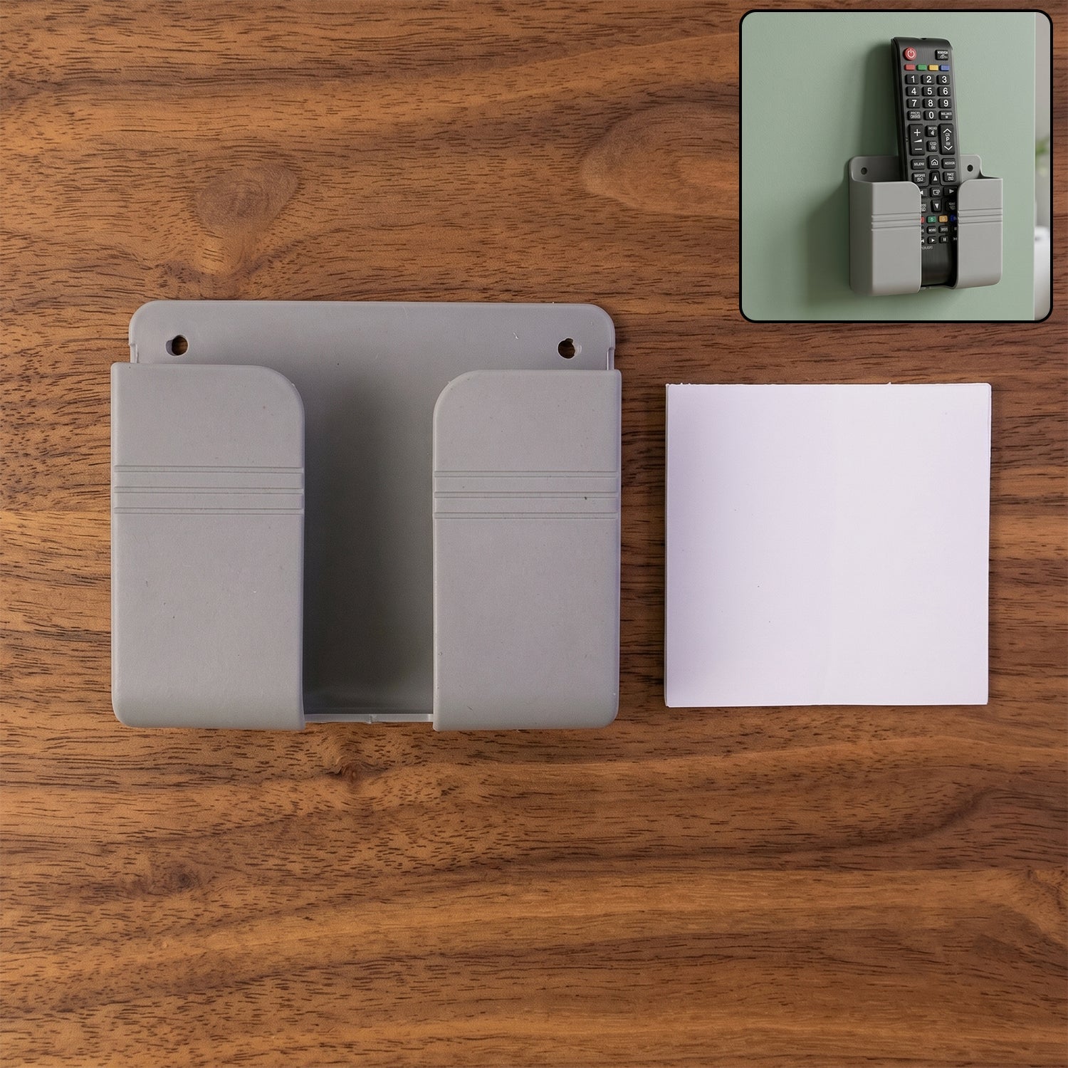 Wall-mounted mobile and remote holder in grey for organized devices