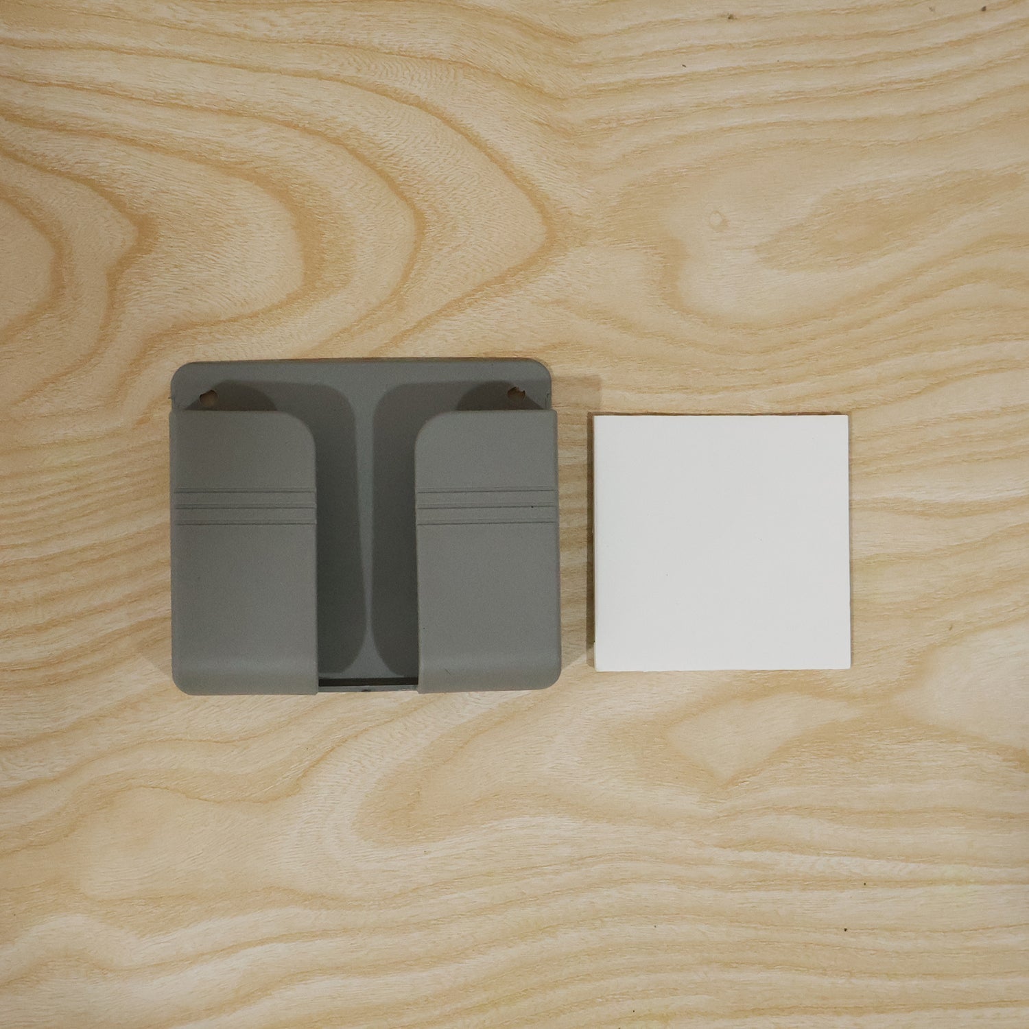 Installation of wall-mounted holder with adhesive and screw options
