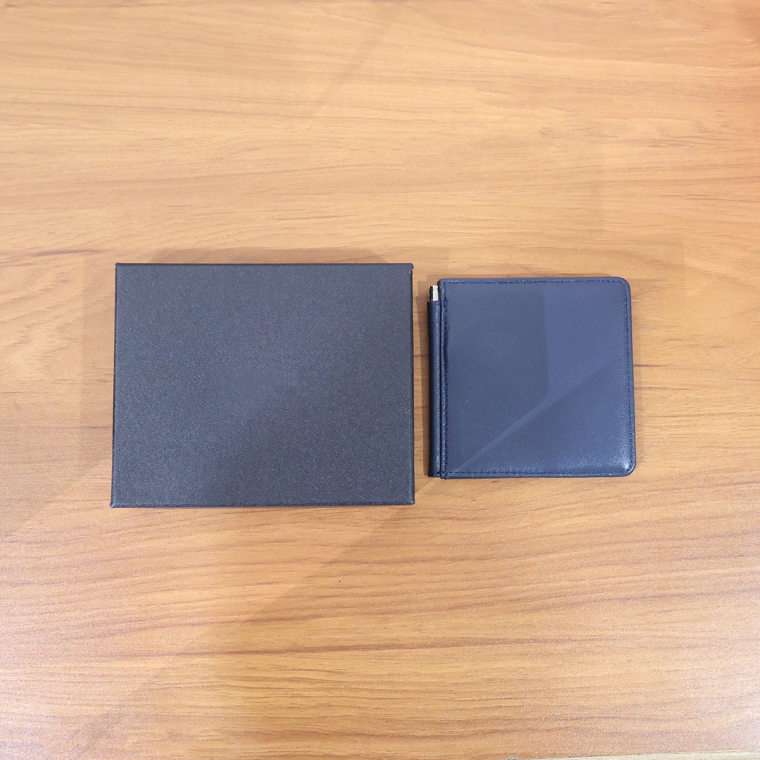 Slim leather-style bi-fold wallet for men in box