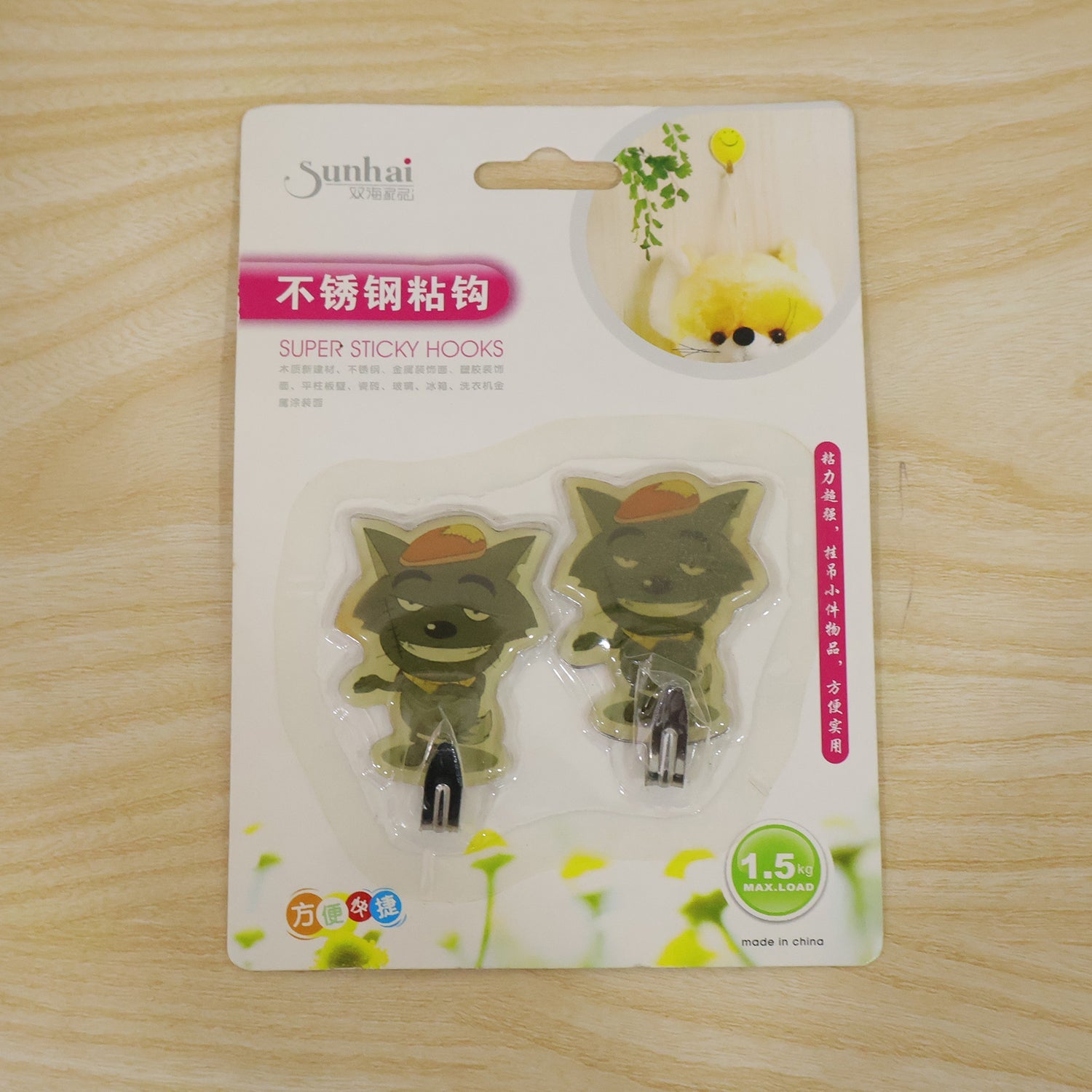 Adhesive pad on the back of the cartoon hook