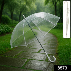 Clear transparent umbrella in use on rainy day
