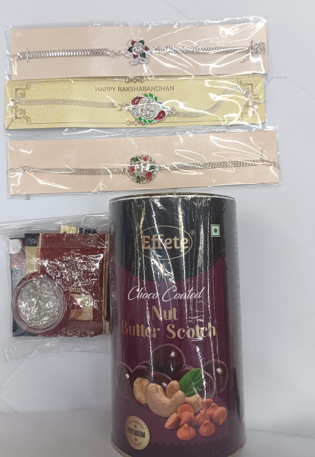 3 Rakhi Gift Hamper with Butterscotch Chocolate Canister, Roli Chawal Set, Silver Coins & Festive Rakhi Card,Rakhi Gift Combo
