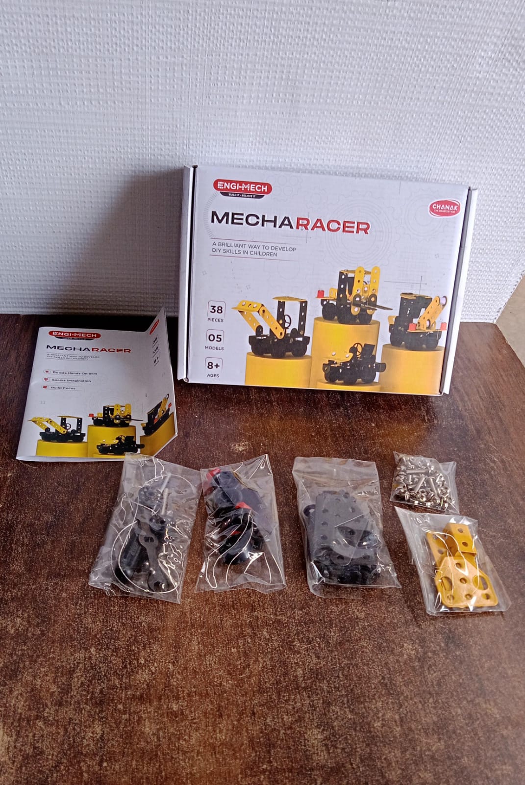 Aditi Mecha Racer kit box with various models on display