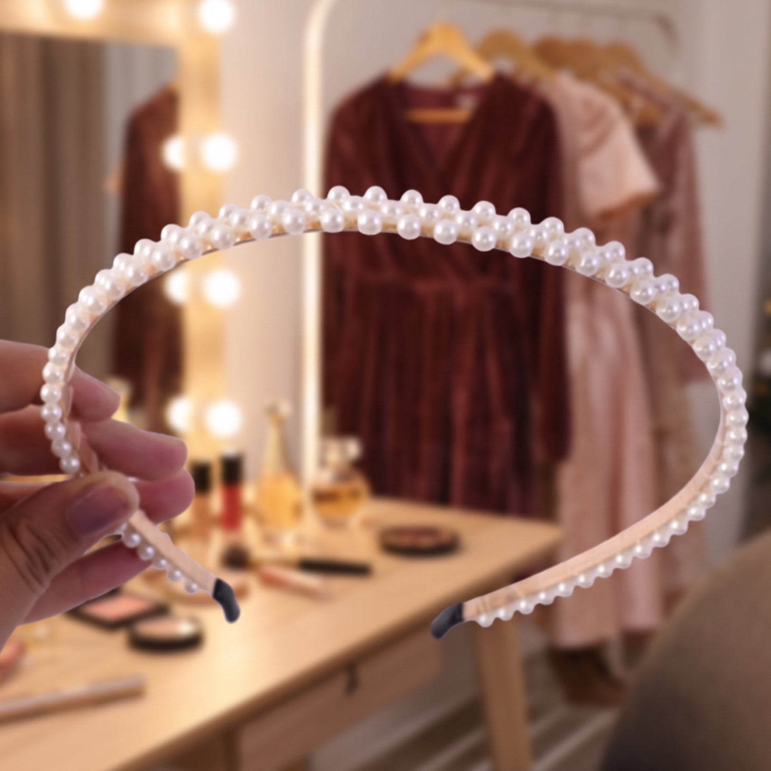 Pearl hairband on a model's head, showing full style