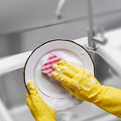 Close-up of large yellow cleaning gloves