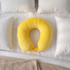 Neck pillow worn while resting on a flight