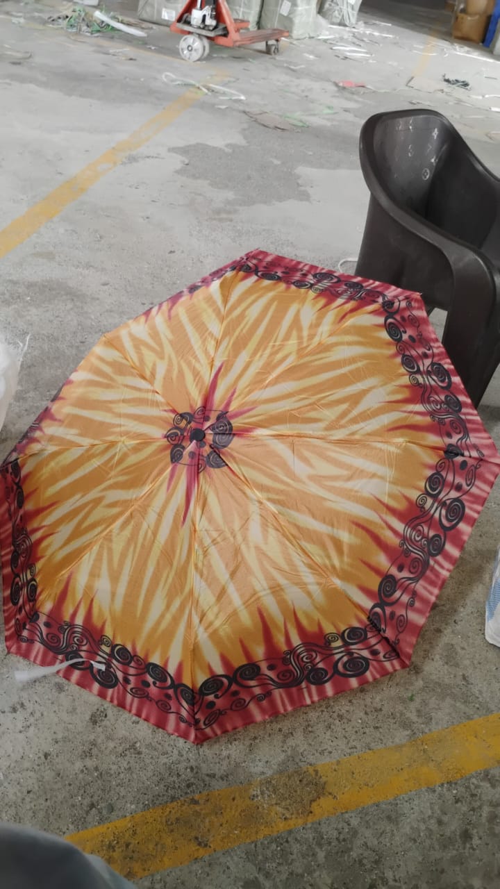 Lifestyle image of person holding foldable umbrella outdoors
