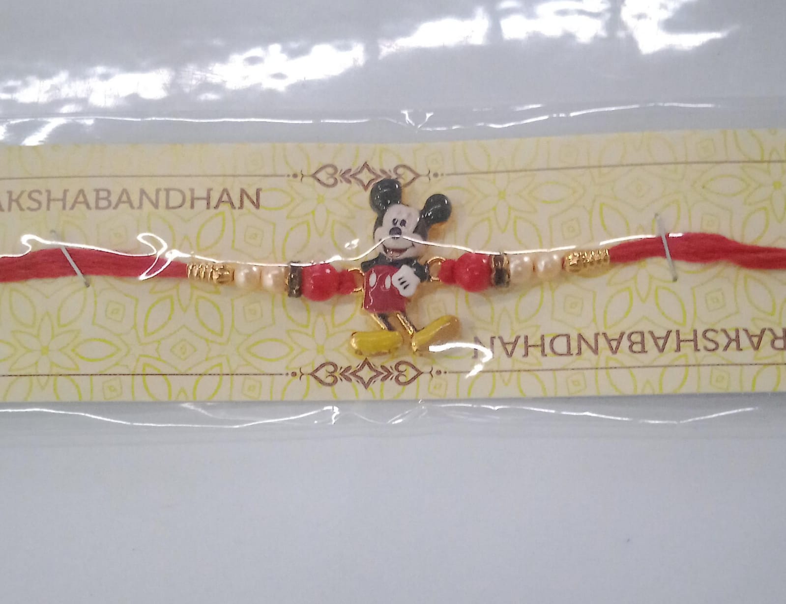 Adorable Mickey Mouse Kids Rakhi with Pearls & Golden Beads on Red Thread