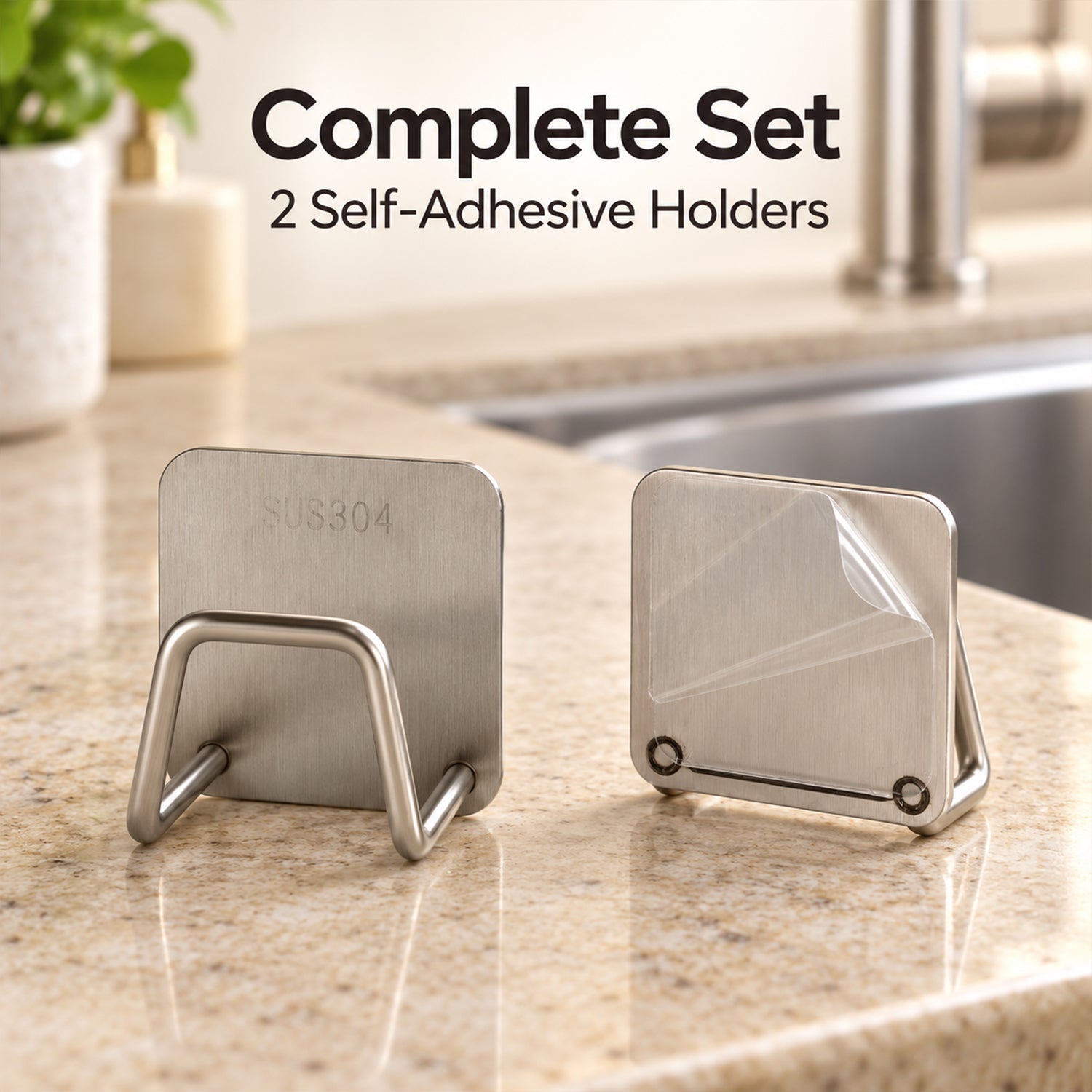 Two stainless steel sponge holders, one with a clear protective film, sit on a granite counter near a kitchen faucet.