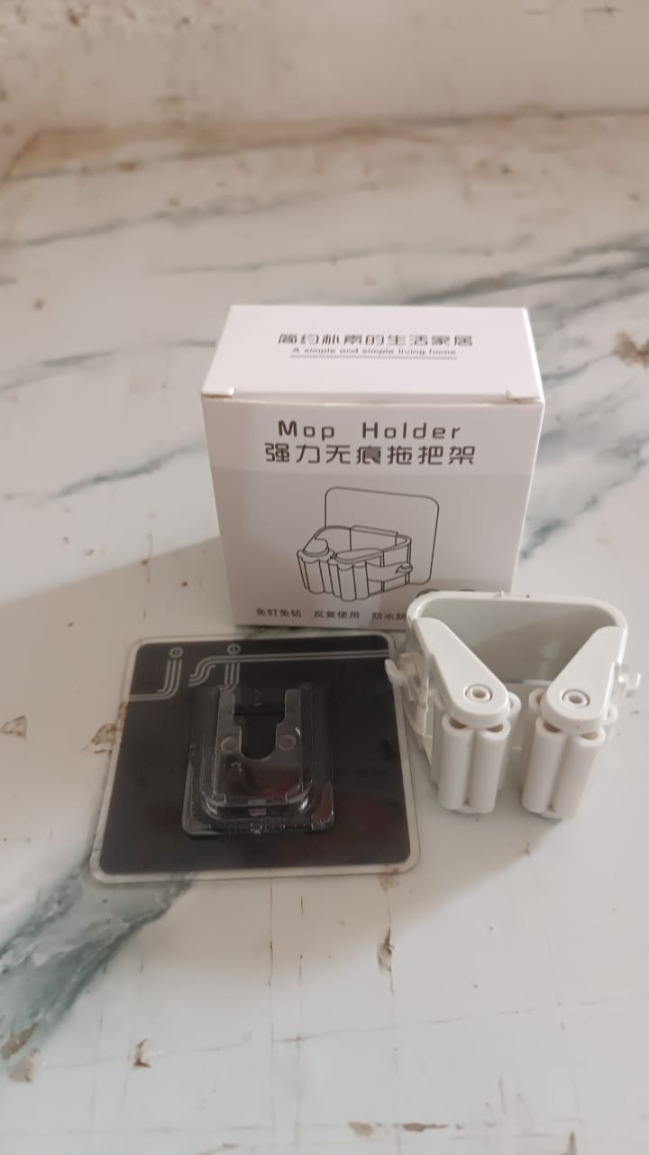 Wall mounted broom holder with strong adhesive backing