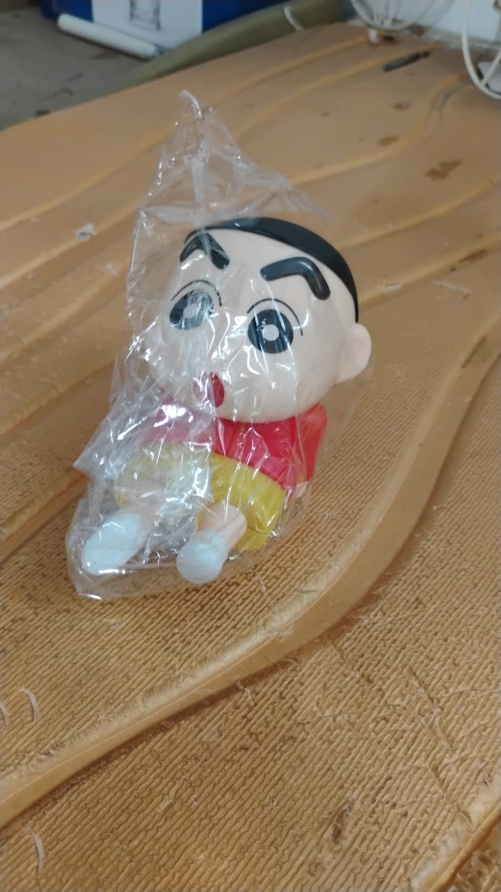 Shinchan Figurine displayed on shelf