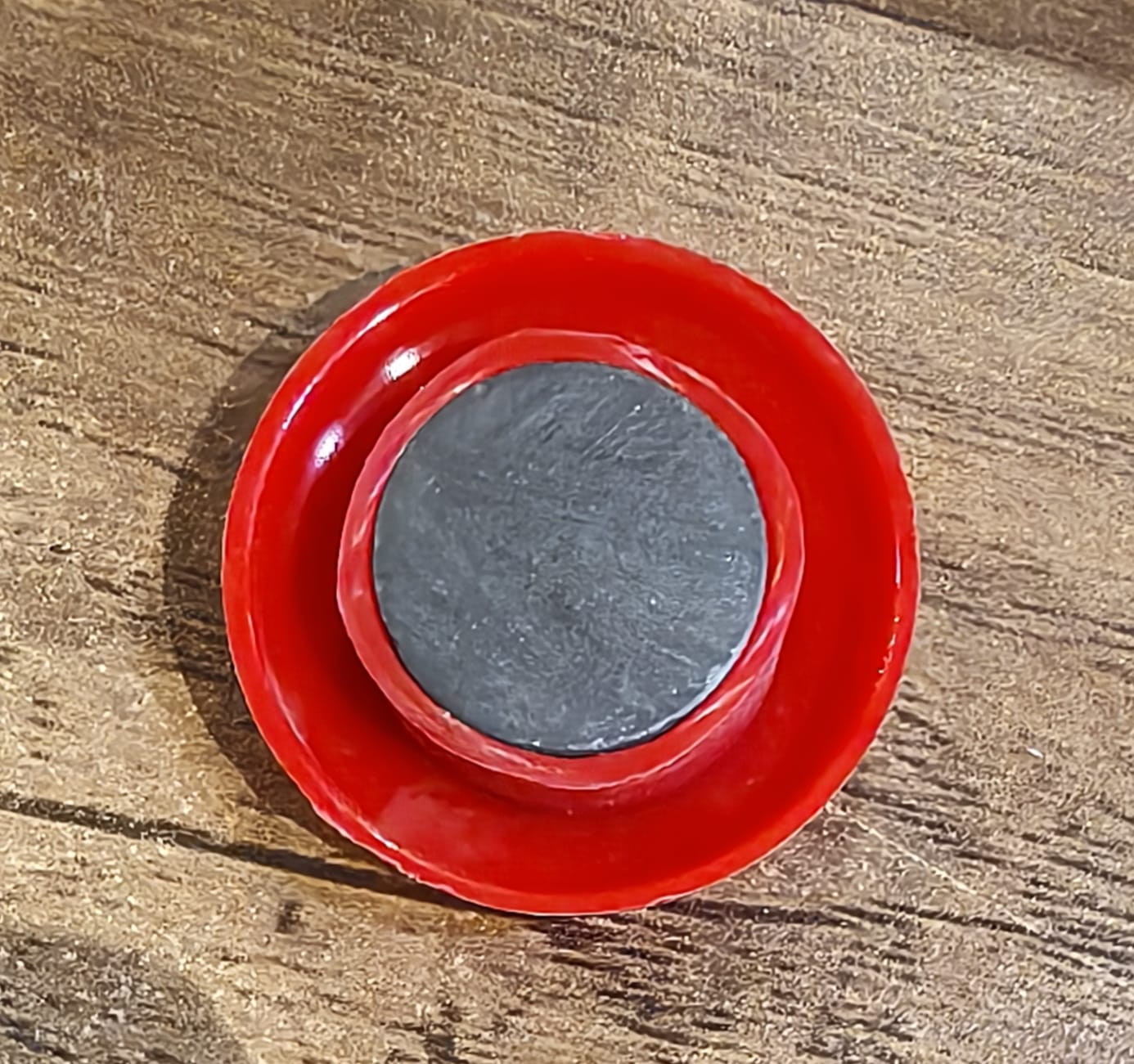 Red magnetic buttons arranged on board