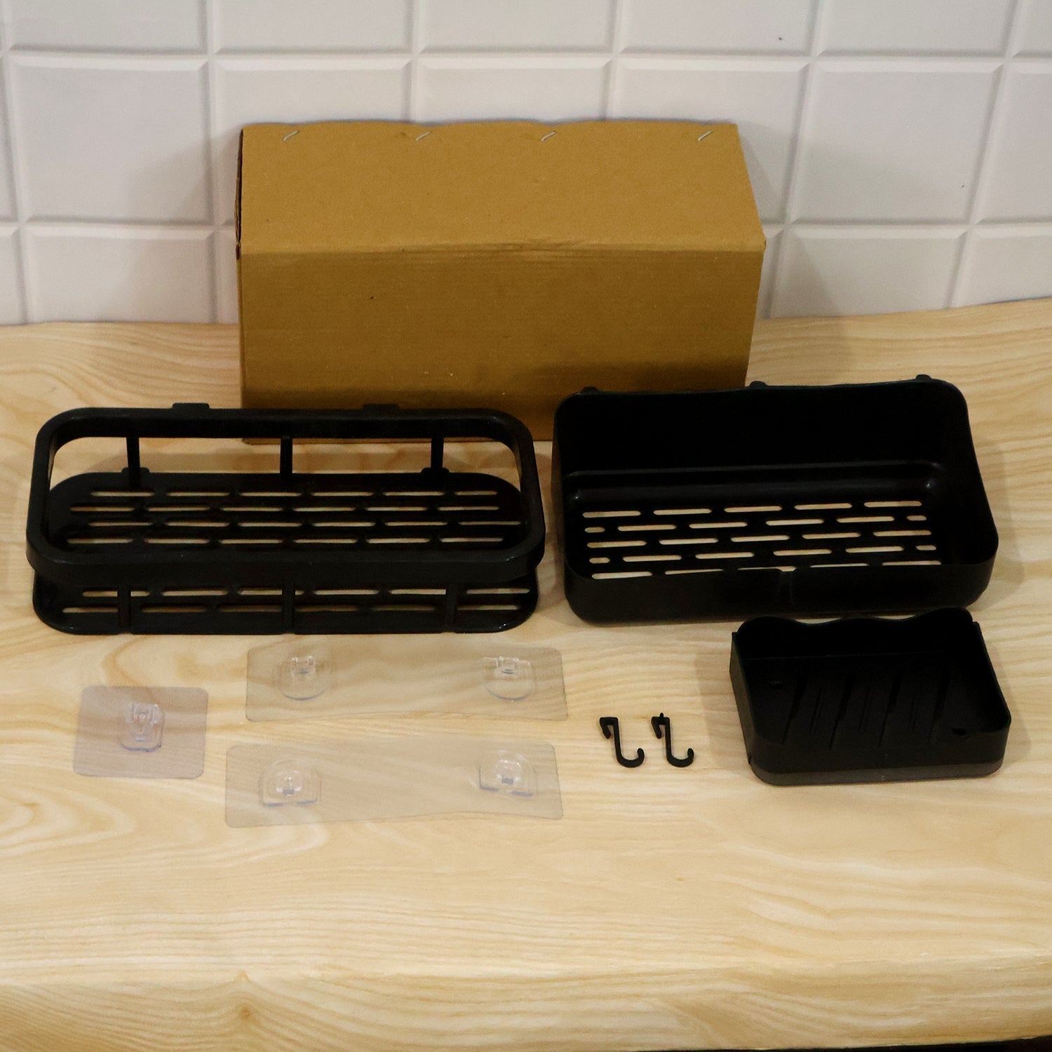 Packaging for the black plastic bathroom shower caddy set