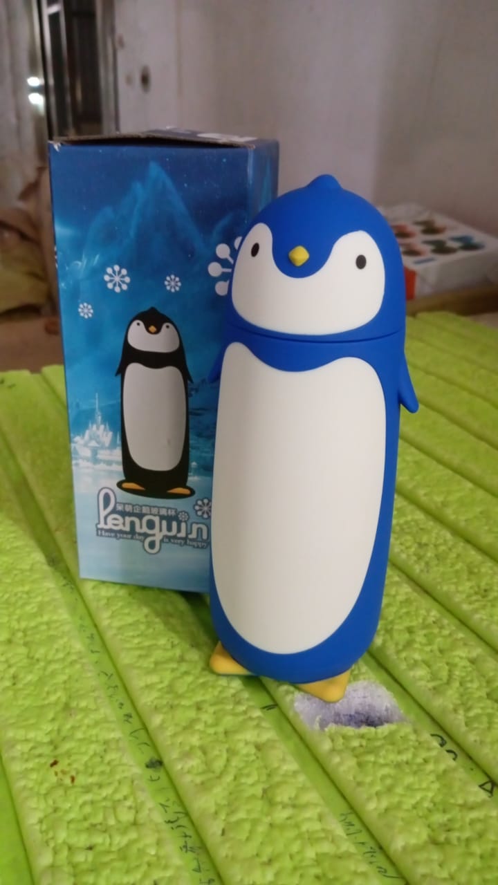Close-up of the adorable blue & black penguin face on the water bottle