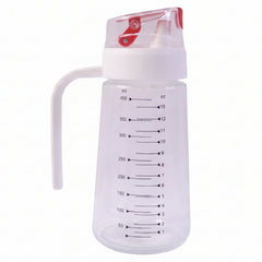 500ml Clear Glass Oil Dispenser Bottle with White Side Handle, Red Auto-Flip Lid and Printed ml and oz Measurement Scale on White Background