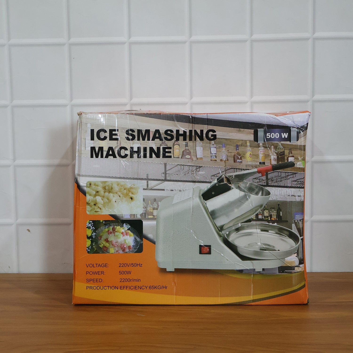 Person using electric ice crushing machine to make a drink