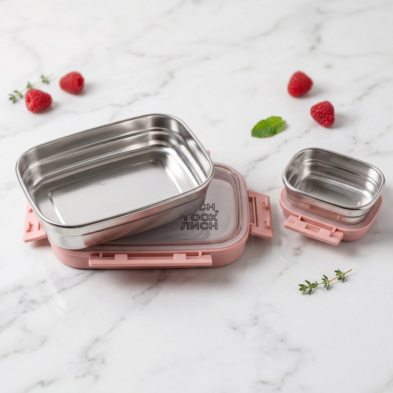 Side view of Ganesh stainless steel lunch box set, showing profile