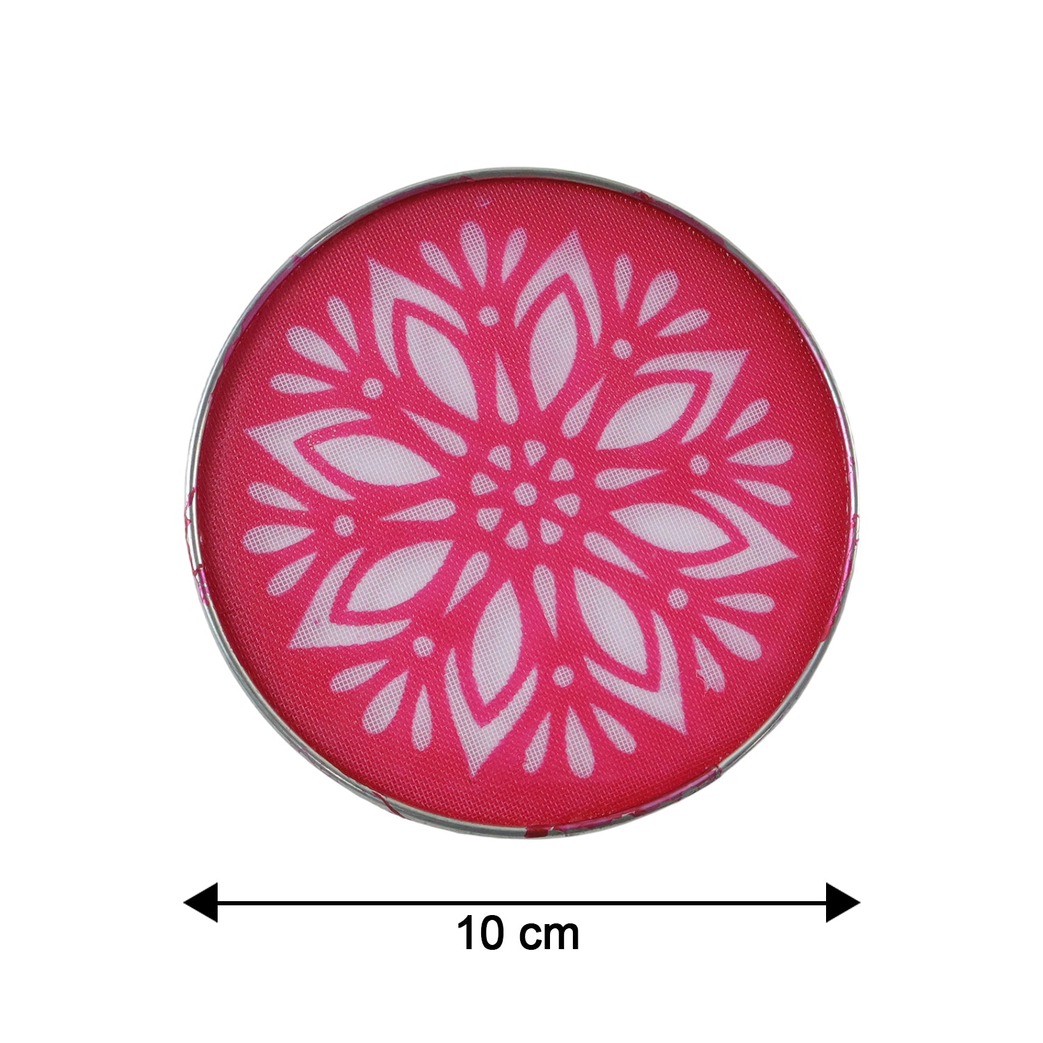 A circular rangoli stencil with a white floral design on a pink surface, showing a 10 cm measurement beneath it.
