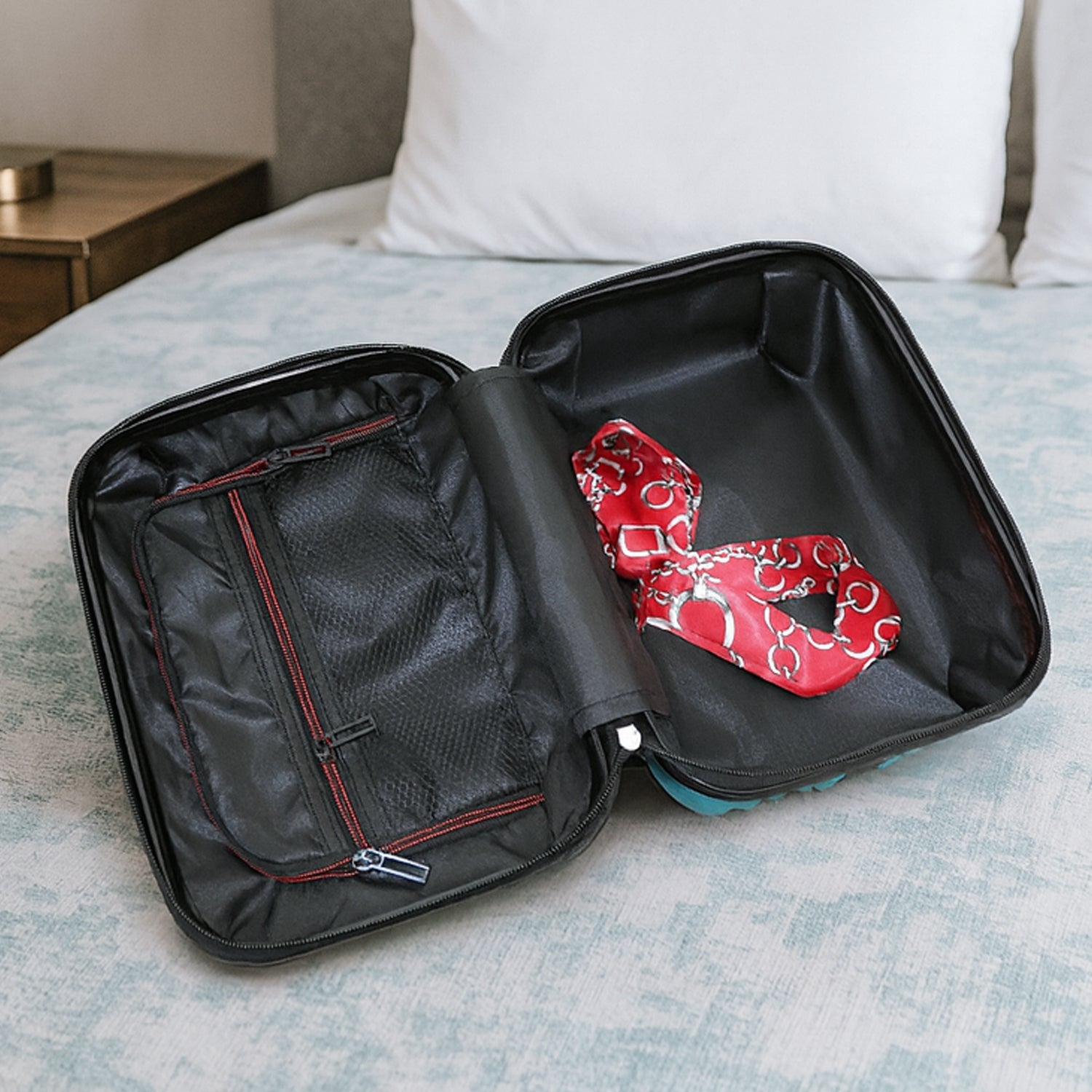 Side view of suitcase from the 4-in-1 hard shell luggage set showing handle and wheels