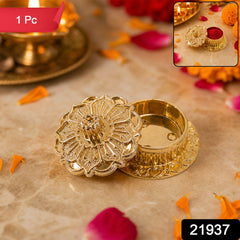 Side view of golden kankavati container with lid for pooja rituals