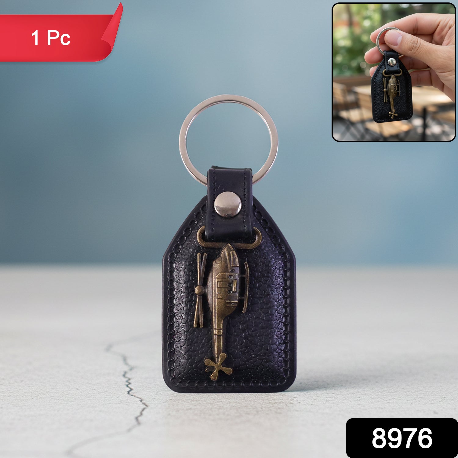 Leather metal sword emblem keychain close-up detail