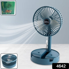 Blue table fan on desk