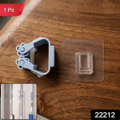 Close up of the adjustable roller ball clamp on the self-adhesive broom mop holder.