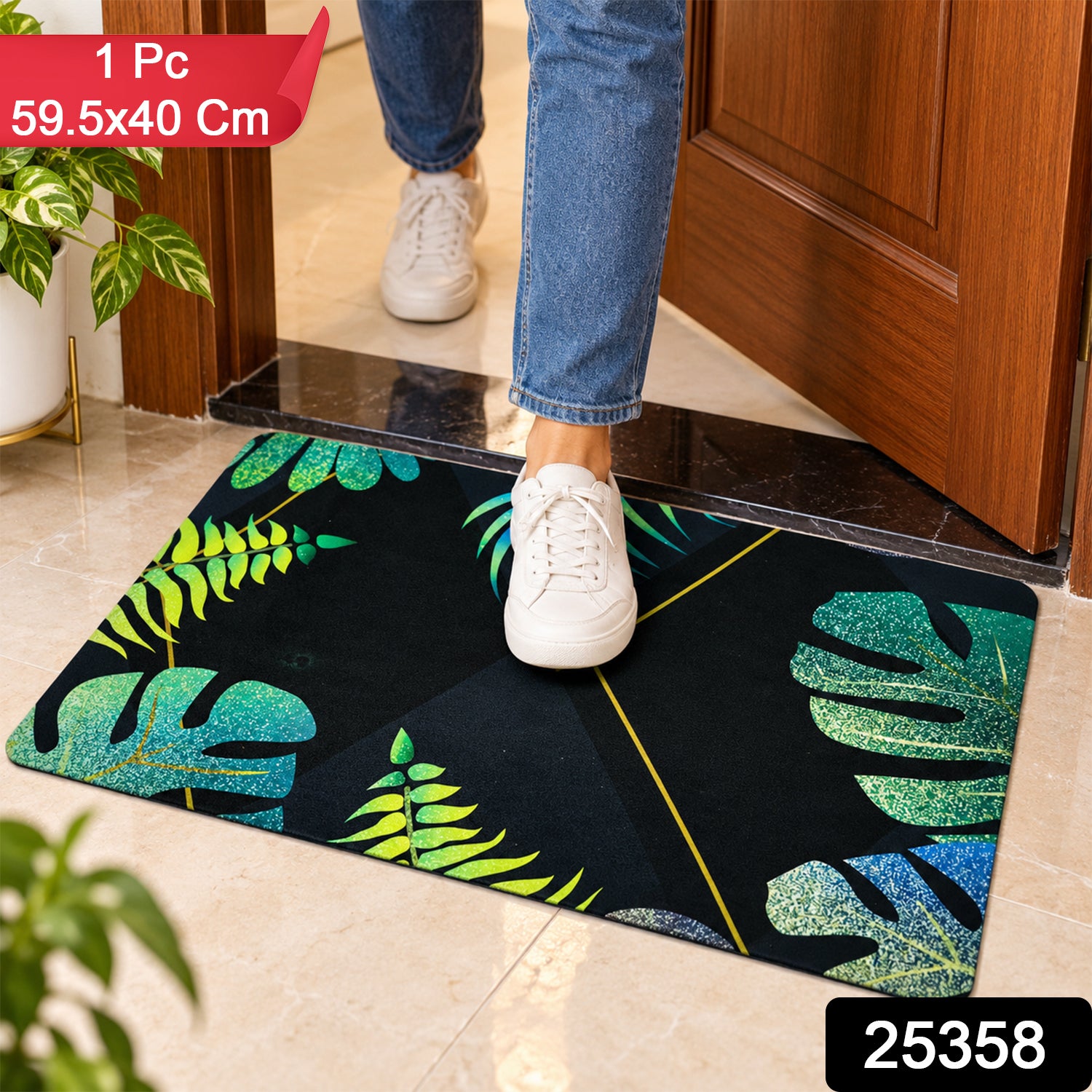 A person's feet in white sneakers are shown stepping on a black mat with green and blue tropical leaves.