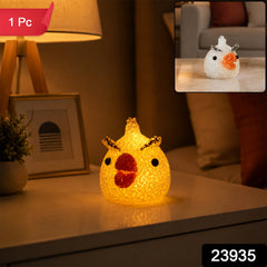 A glowing yellow chick-shaped night lamp on a nightstand, with a red "1 Pc" label in the top left corner.