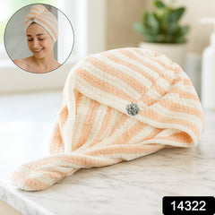 Close-up of teddy bear button closure on hair drying towel wrap