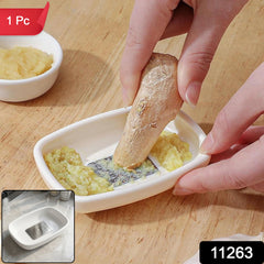 Close-up of the garlic ginger grater plate showing its compact dish shape