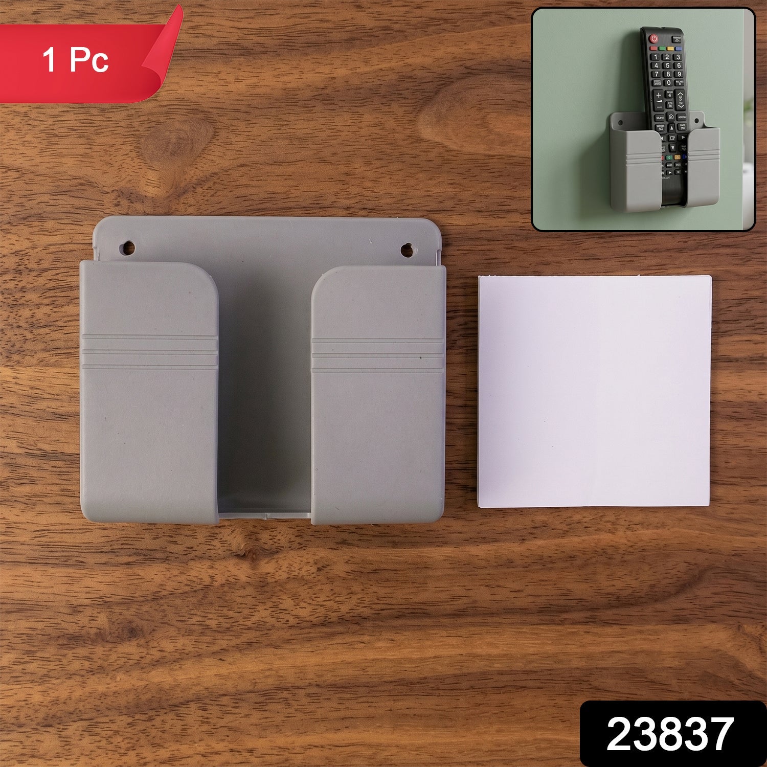 Sturdy plastic wall mount for phones and remote controls shown in grey