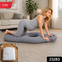 A pregnant woman in grey attire kneels on a grey inflatable mat with a belly hole in a living room, with a small inset