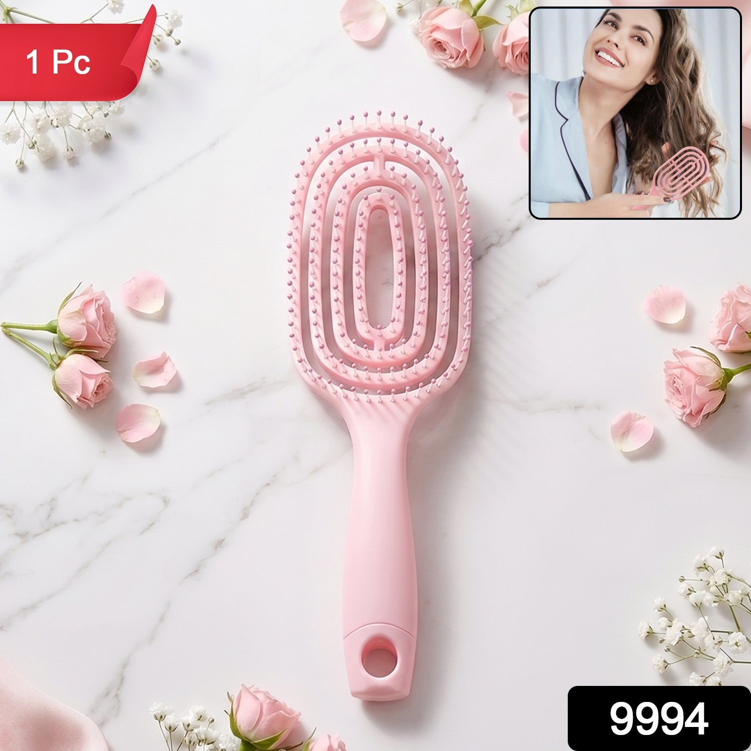 Pink curved vented detangling hair brush in packaging