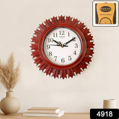 Close-up of wooden look wall clock showing large numerals